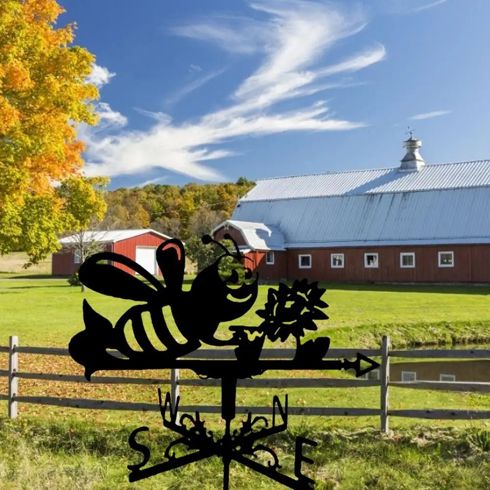 Girouette originale abeille butinant, pré fleuri, ciel bleu nuageux, campagne.