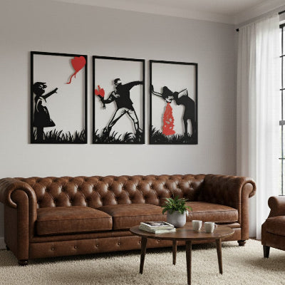 Decoration Murale pour Salon élégant noir et rouge au-dessus d'un canapé Chesterfield marron.