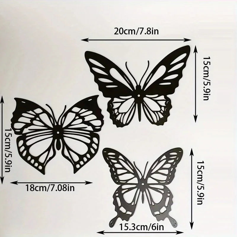 Decoration Murale Papillons: Trois papillons métalliques noirs, tailles variées, pour décoration.