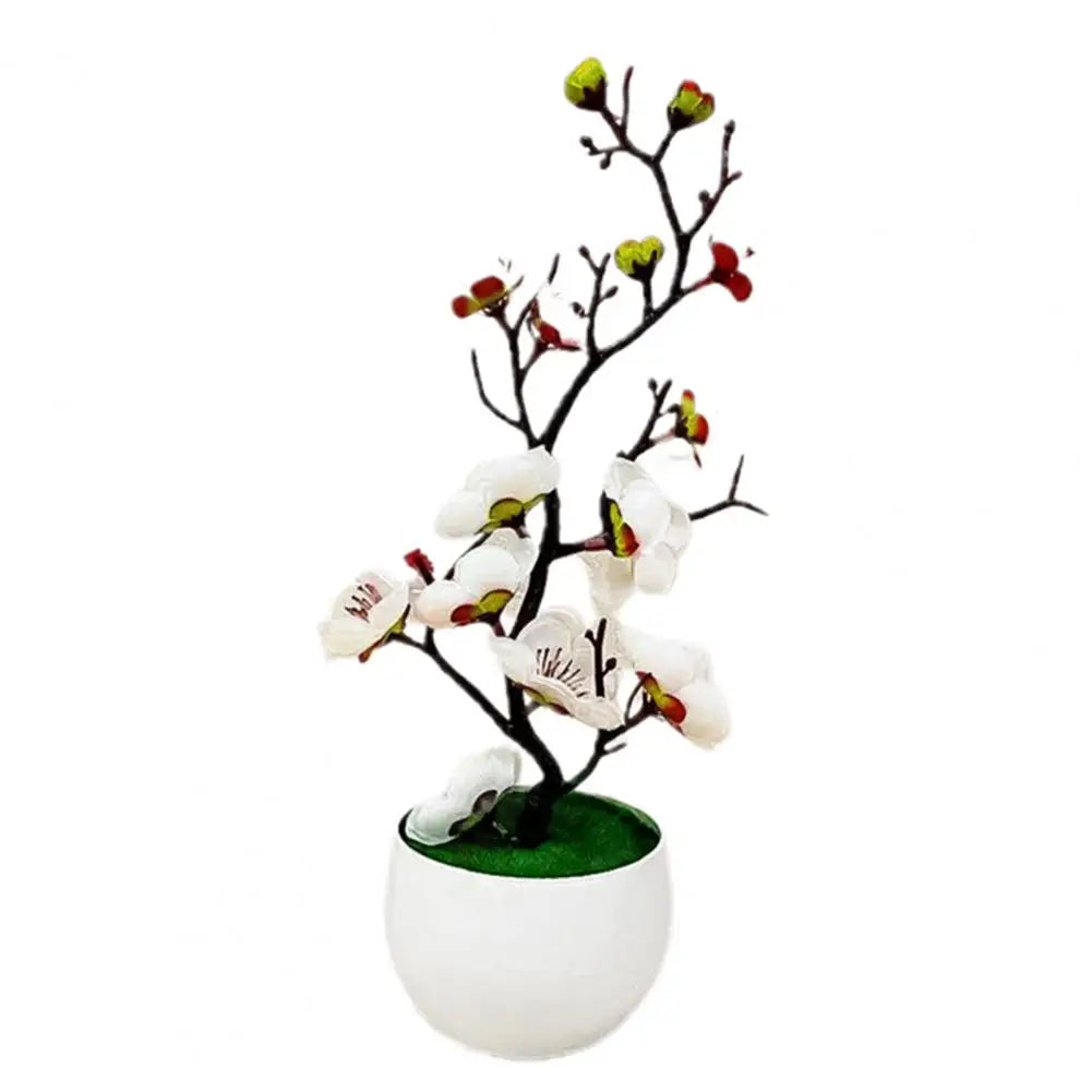 Plante artificielle blanche en pot, fleurs réalistes, branches délicates, décoration intérieure.
