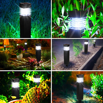 Un lampadaire dextérieur moderne est entouré de fleurs aux couleurs vives dans des tons orange, rose et violet. Une grande citrouille bleu-gris trône au premier plan, mettant en valeur le décor coloré du jardin.