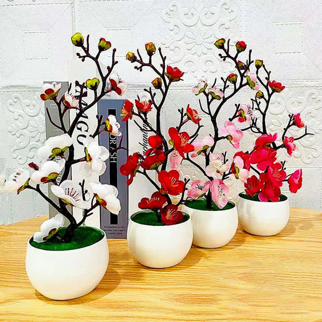 Quatre plante artificielle en pots blancs, fleurs roses, rouges, blanches, décoratives.