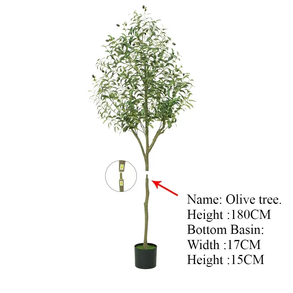 Plante artificielle d'extérieur - Olivier, 180 cm de haut, feuilles vertes, dans un pot noir (17 cm de large, 15 cm de haut), idéale pour tout jardin méditerranéen. Une flèche rouge pointe vers le tronc, accentuant son attrait décoratif.