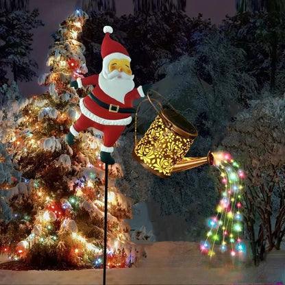 Père Noël solaire avec arrosoir LED cascade pour décoration de jardin Noël, étanche IP65, décor festif extérieur.