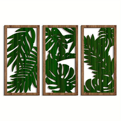 Trois panneaux de decoration murale en bois, motif feuilles tropicales vertes, style moderne.