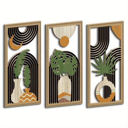 Trois decoration murale bois, motifs géométriques noirs, feuilles vertes stylisées, vases beiges.
