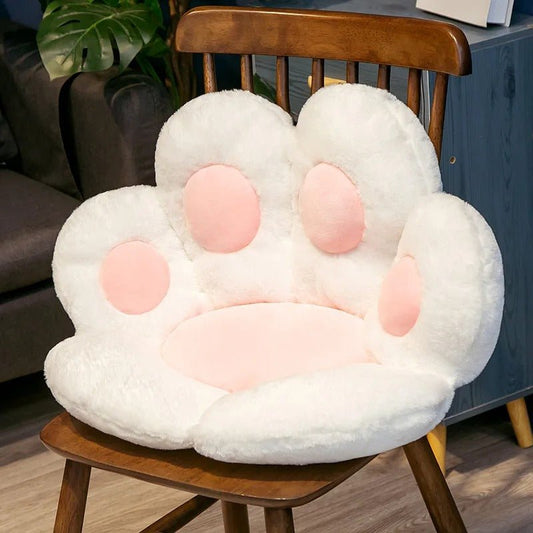 Coussin de sol patte animal blanc avec coussinets roses 70x60cm vue frontale
