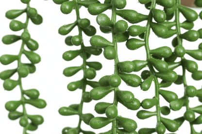 Detalle ultra realista de hojas en forma de perlas verdes de planta artificial 1 pieza, textura de alta calidad, follaje artificial tipo suculenta