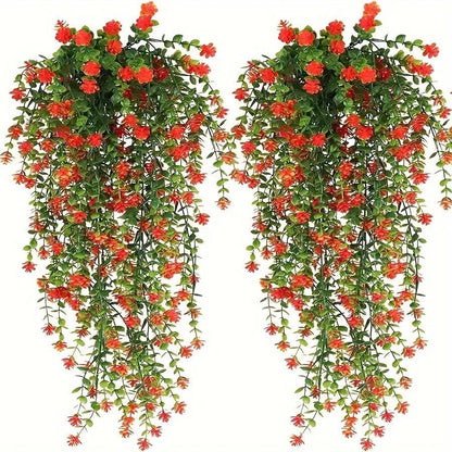 Deux Plantes artificielles tombante-Cascade Bohème aux feuilles vertes luxuriantes et aux grappes de fleurs rouge-orange sont disposées côte à côte sur un fond blanc, créant un décor végétal luxuriant et une atmosphère apaisante.